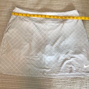 Nike Dri-Fit golf skort. New with tags. Size L.